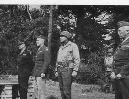 Gen. Dwight Eisenhower (from left), Gen. Baade, Col. Miltonberger, General Patton, and an aide review the 134th in Cornwall, England; June 1944