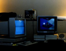 Sun-2/50 and SGI 3030 computer workstations on U.S. Army desk